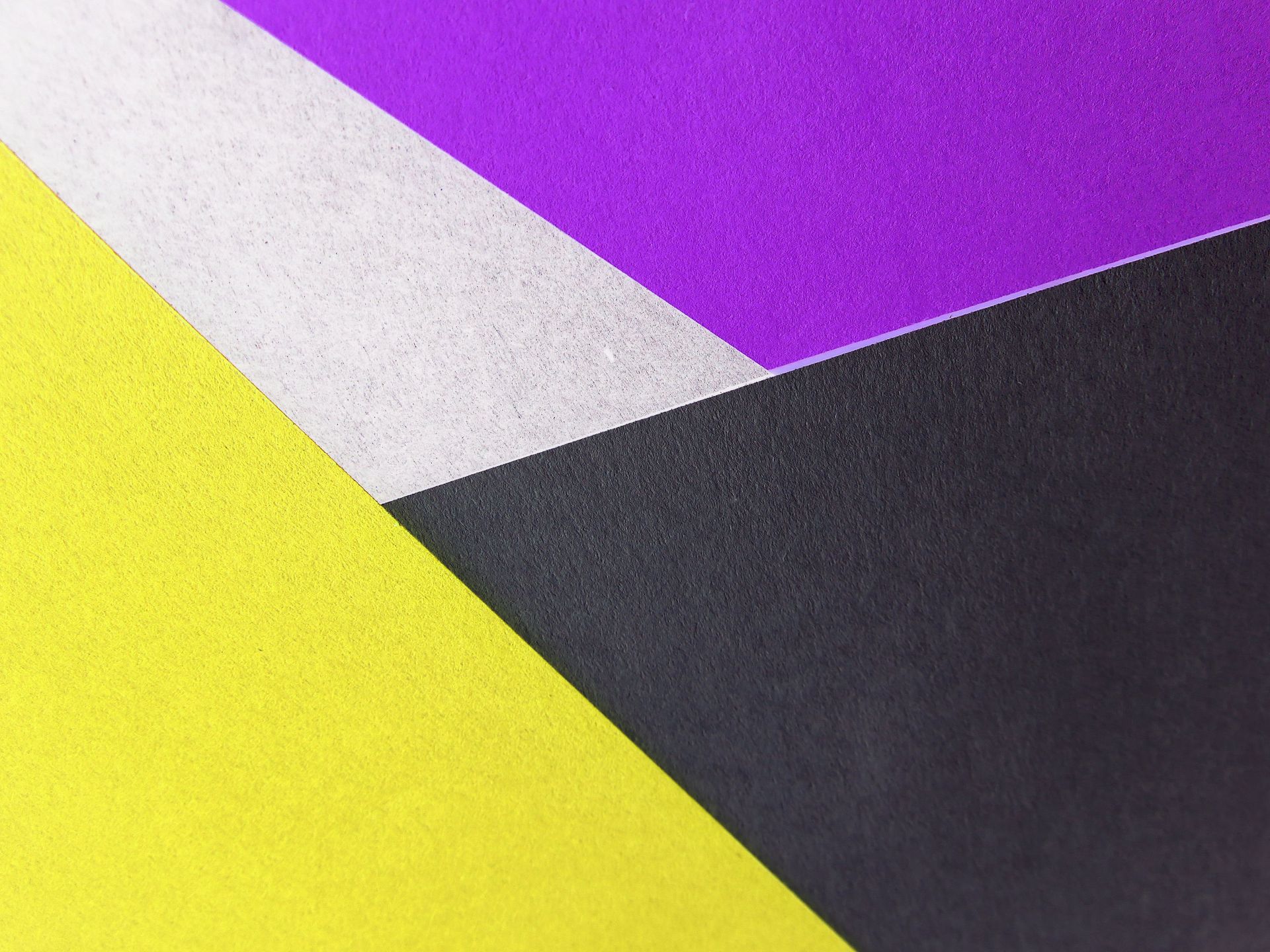Yellow, Black and Purple Colored Papers